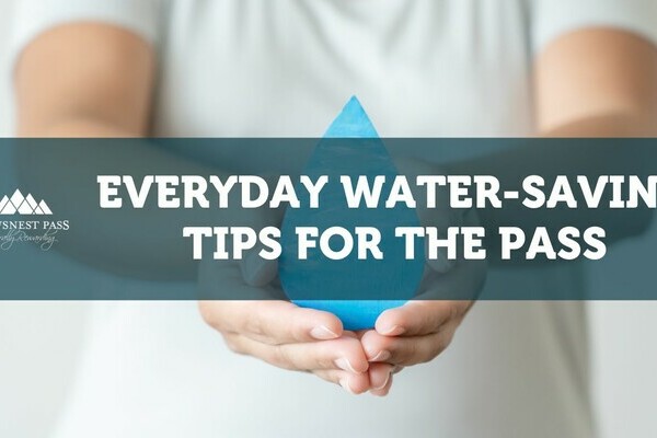 a woman holding a water droplet