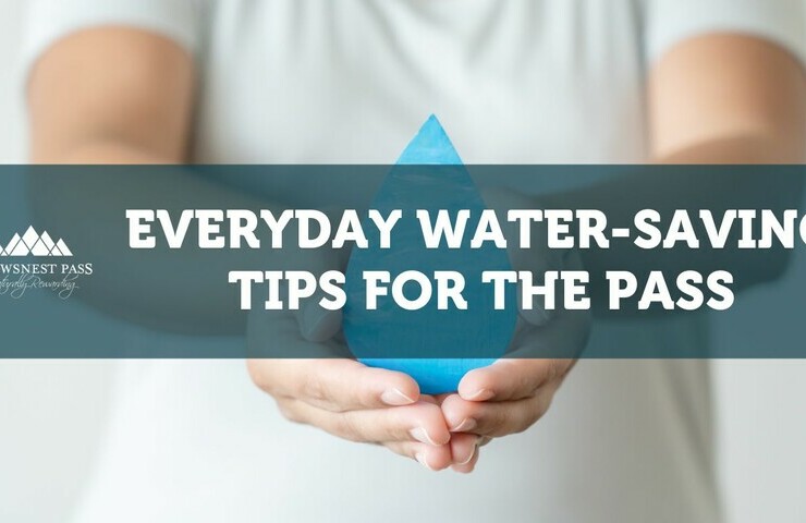 a woman holding a water droplet
